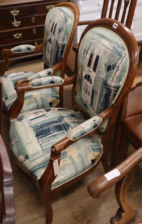 Two 19th century French walnut open armchairs